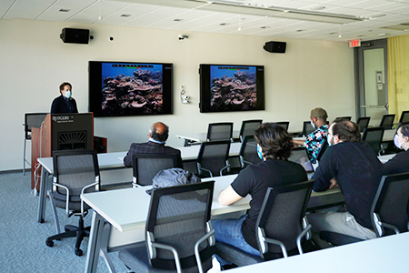 Students and faculty at a seminar.