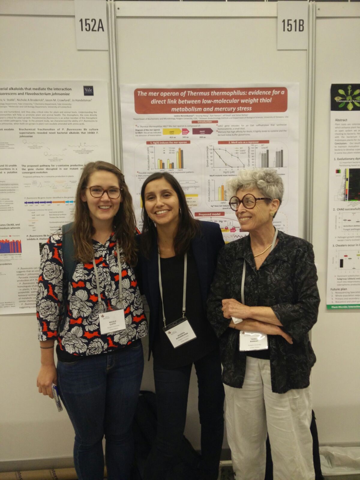 Nicole Lloyd, Javiera N Morales, and Tamar Barkay standing in front of a poster.
