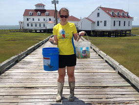 Microbial Biology Ph.D student Nicole Lloyd collecting water samples.
